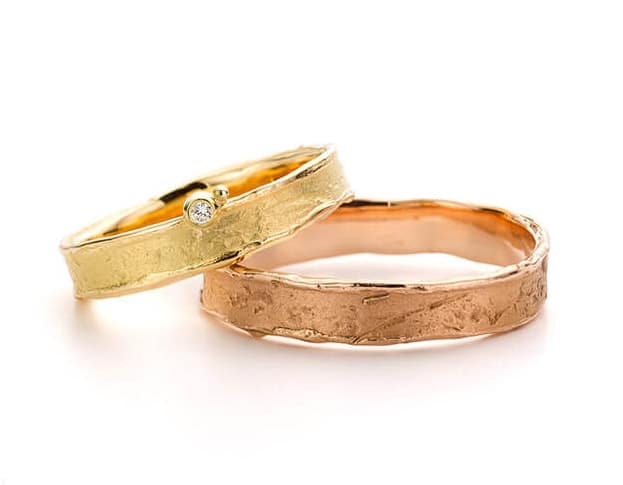 Handmade wedding rings Erosion. Yellow gold ring with diamond. Rose gold textured wedding ring. Oogst goldsmith Amsterdam