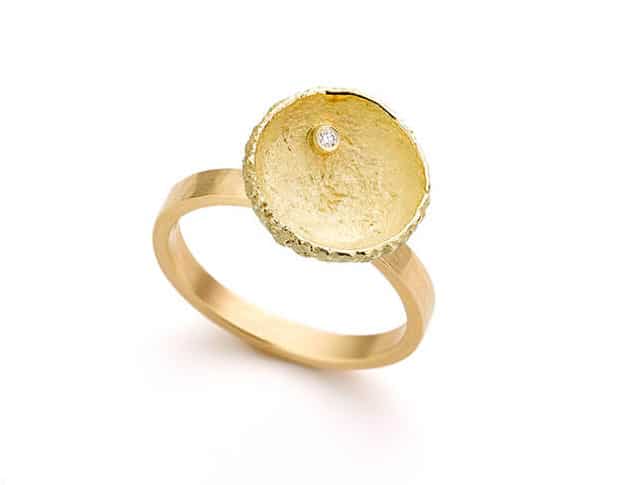 Yellow golden ring with acorn and diamond. Oogst Amsterdam.