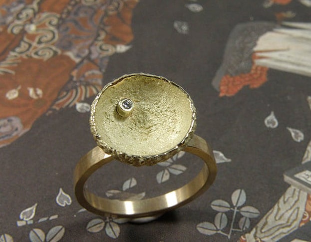 Yellow golden ring with acorn and diamond. Oogst Amsterdam.