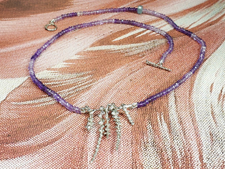 Amethyst necklace with white gold blossom twigs. Design by Oogst goldsmith Amsterdam