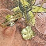 Review Japonais bloesem hanger en Boomgaard ring met 0,22 crt ovaal geslepen diamant cape. Marjo