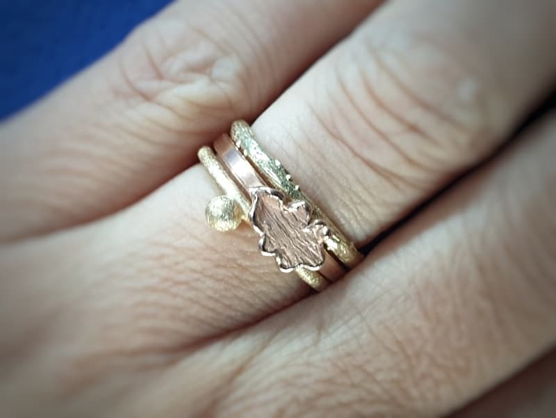 Stack ring. Yellow gold 'Berries' ring , rose gold 'Oak' ring and yellow gold 'Orchard' ring.