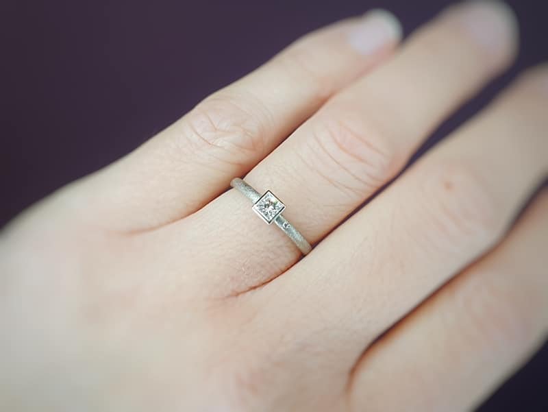 White gold engagement ring with princess cut diamond. Carré. Design by Oogst goldsmith in Amsterdam.