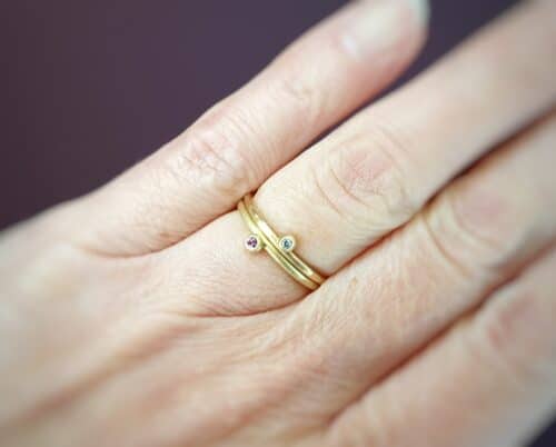 Stack rings Berries. Yellow gold with a pink diamond. Rose gold with a blue diamond. Oogst goldsmith Amsterdam