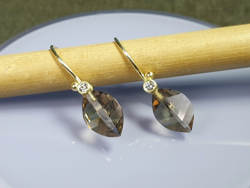 Golden earrings with Smokey Quartz & diamonds from the Leaves series. Modern classic design by Oogst goldsmith in Amsterdam