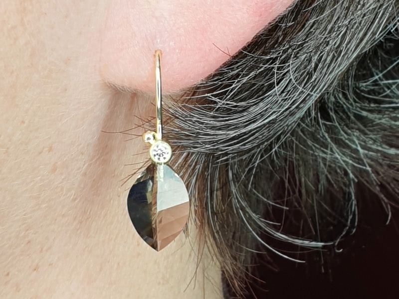 Golden earrings with Smokey Quartz & diamonds from the Leaves series. Modern classic design by Oogst goldsmith in Amsterdam
