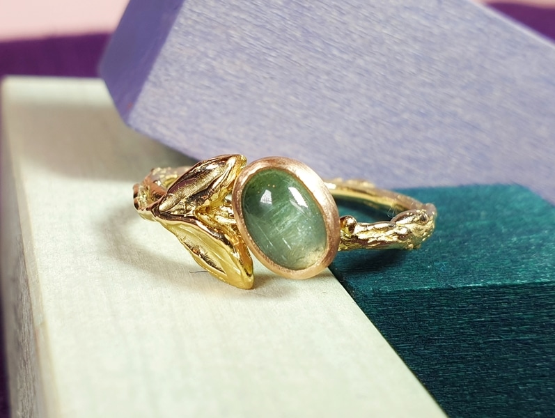 Golden ring with tourmaline and cute leaves from the ‘Orchard’ series. Design by Oogst Jewelry in Amsterdam