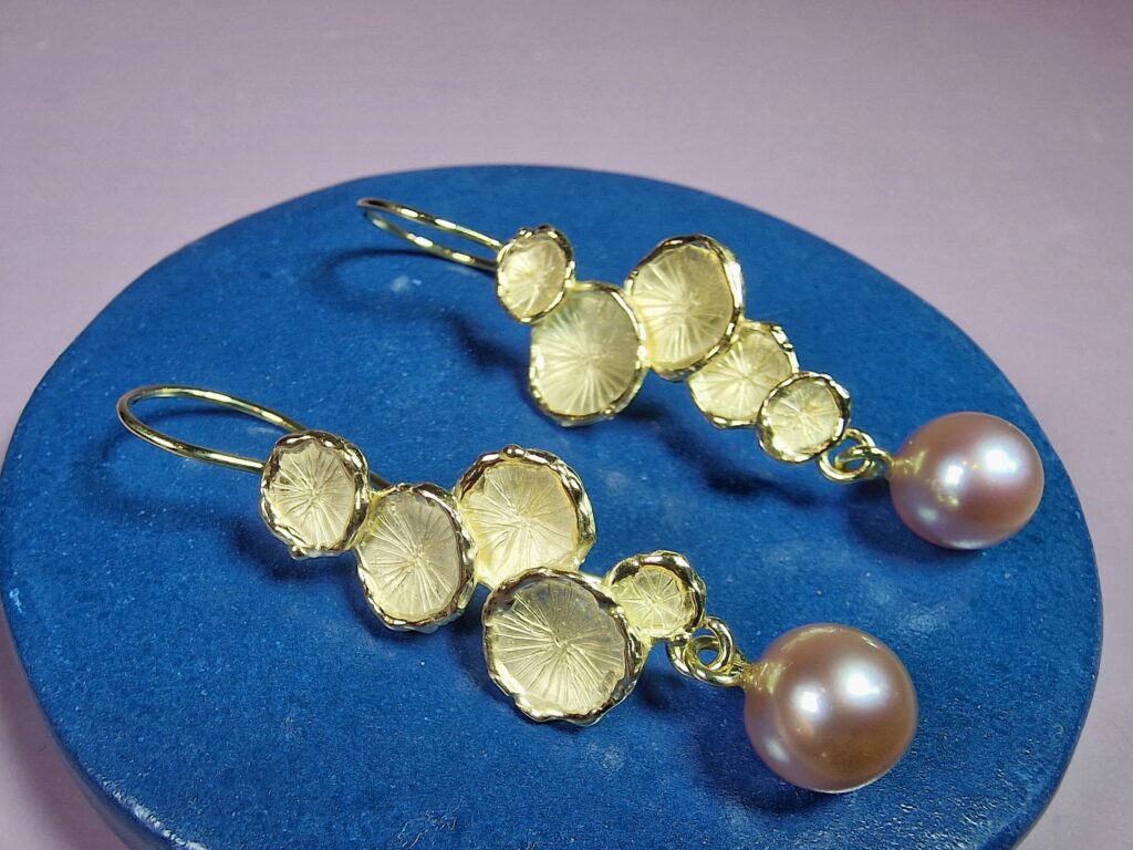 Yellow gold Fungus earrings with fresh water pearls. Standout design by Oogst Jewellery in Amsterdam