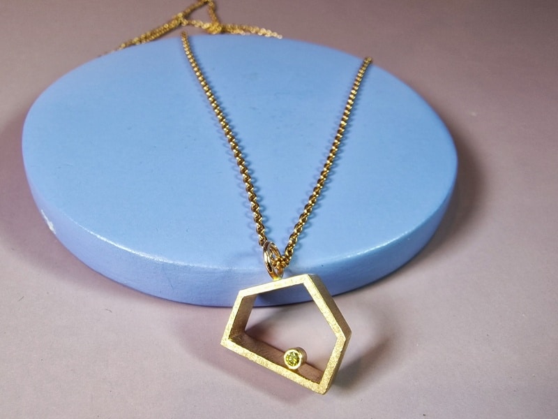 Rosé gold 'Home sweet home' pendant with a 0,025 ct brilliant cut diamond, on a delicate necklace. Created by Oogst studio in Amsterdam.