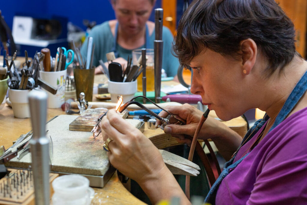 Soldering a ring. At work in the Oogst goldsmith studio.