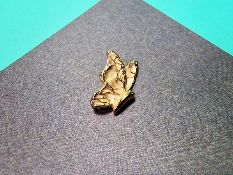 Rosé golden 'Butterfly' pendant from our 'Insects' series. Oogst Jewellery in Amsterdam.